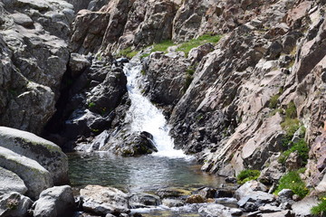 Small mountainous waterfall in a rocky place