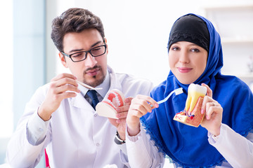Dentist doctor and assistant working on new tooth implant