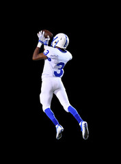 Football player making a catch during a football game © Joe