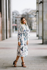 portrait of a beautiful young girl in an outdoor dress