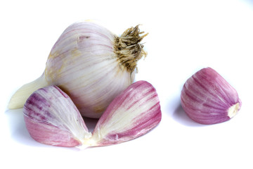 Three garlic cloves isolated on white background