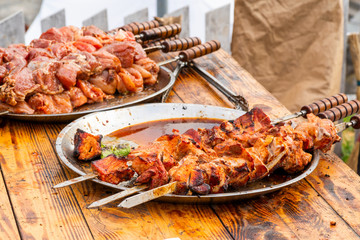 cooking fresh meat for barbecue on skewers
