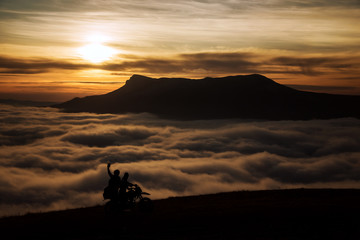 Two tourists motorcyclist in the mountains. Demerdzhi, Crimea. 2016-03-07