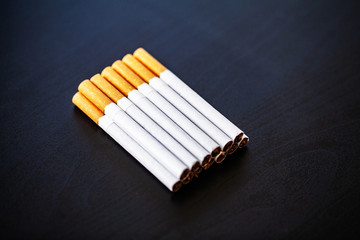 Stop smoking concept on background with broken cigarettes. Heap of cigarettes. No smoking