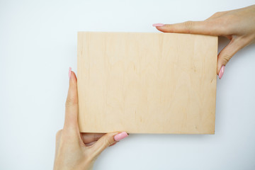 Office Woman Hands Holding a A Tree Board on White Background. Copyspace. Place for Text