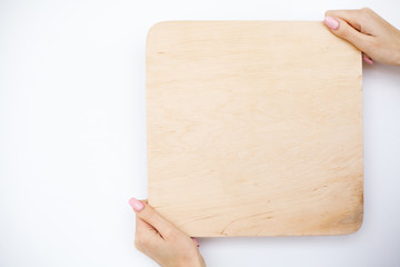 Obraz premium Office Woman Hands Holding a A Tree Board on White Background. Copyspace. Place for Text