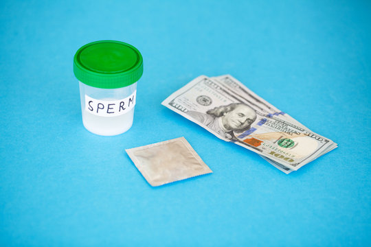 Health. Sample sperm. Donor Sperm Close Concept of Bank Sperm. Sperm on Blue Background.