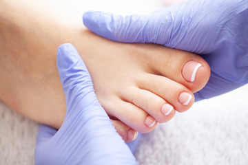 Pedicure Day. Pedicure Specialist Works With the Patient in Spa Salon - obrazy, fototapety, plakaty