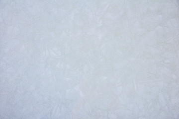 ice texture on a lake water in winter outdoors with snow, background