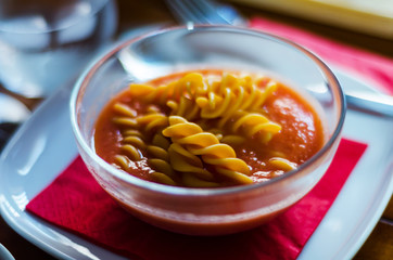 tasty and nutritious tomato soup with fresh pasta, dietary meal