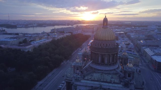Saint-Petersburg, Russia, St. Isaac's Cathedral aerial view, pull in shot, beautiful sunrise clouds on background