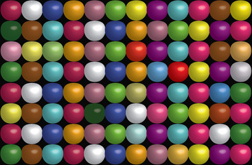 Colored balls of all colors on a black background.The dotted background of rainbow colors.