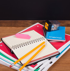 Fototapeta na wymiar Stack of Notebooks on a Desktop
