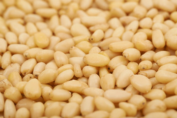 Surface coated with pine nuts