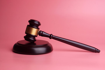 judge's gavel isolated on pink background