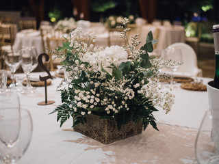 centerpiece of white flowers at a wedding