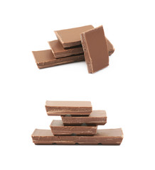 Pile of milk chocolate pieces isolated
