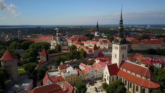 Drone shot of Saint Olaf church and medieval city center of Tallinn, Estonia