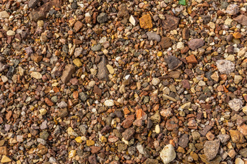 Sea stones on the beach of red sea background or texture.