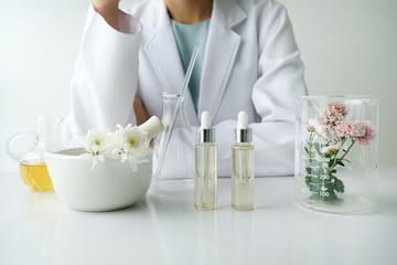the scientist,dermatologist testing the organic natural product in the laboratory.research and...