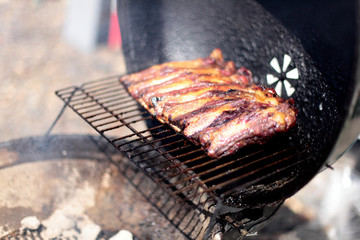 Dry rub beef ribs on the BBQ grill.