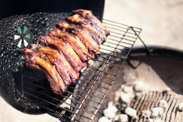 Dry rub beef ribs on the BBQ grill.