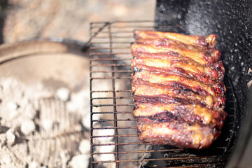Dry rub beef ribs on the BBQ grill.