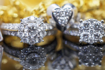 Luxury gold Jewelry diamond rings with reflection on black background