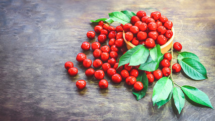 ripe cherries on a wooden background