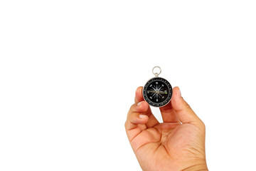 Hand holding the black compass isolated on white.