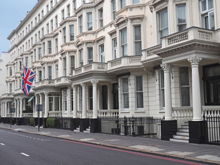 Fototapeta na wymiar London, row of apartment buildings with portico entrances