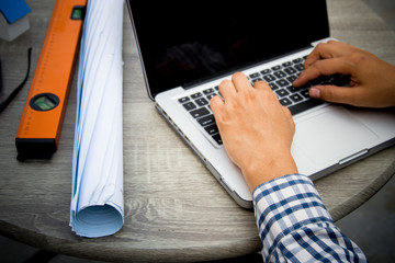 Engineer and Architect planing and discuss at Construction Site with blueprint