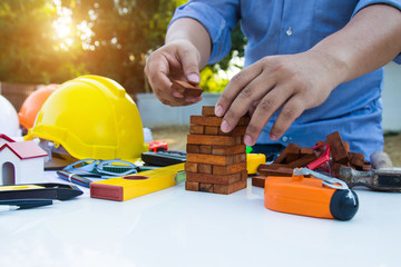 Engineer and Architect drawings blueprint  at Construction Site