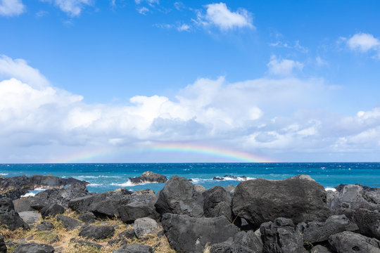 Rainbow over the Indian Ocean from the Gulf of Etang Sale in Reunion Island