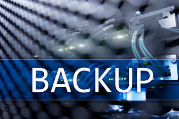 Backup button on modern server room background. Data loss prevention. System recovery.