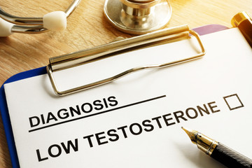 Diagnosis Low testosterone and pen on a desk. - obrazy, fototapety, plakaty