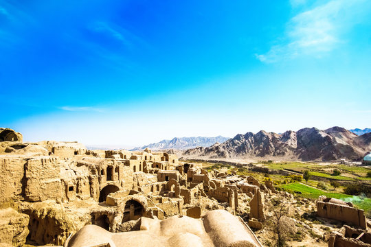 Panoramic view over abonded ghost town of Kharanaq in Iran