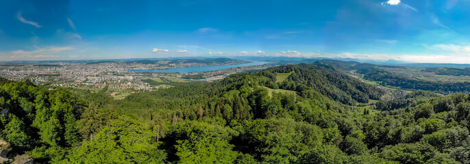 Naklejka na ściany i meble Panoramic view of Zurich lake and Alps from the top of Uetliberg mountain, from the observation platform on tower on Mt. Uetliberg, Switzerland, Europe