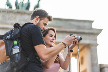 low angle view of tourists looking at photo camera in front of Brandenburg Gate, Berlin, Germany © LIGHTFIELD STUDIOS