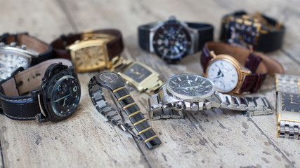 Many different watches piled into one pile