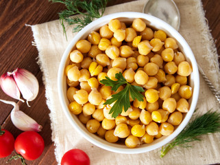 Cooked Chickpeas on bowl on dark wooden table. Healthy, vegetari