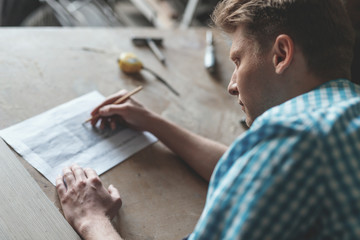 Young carpenter with a project