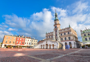 Zamosc, Poland - August 22, 2017: Ancient Town Hall of Zamosc and dramatic sky.  Town Zamosc is  UNESCO World Heritage List site. - obrazy, fototapety, plakaty
