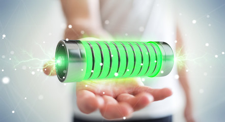 Businessman using green battery with lightnings 3D rendering
