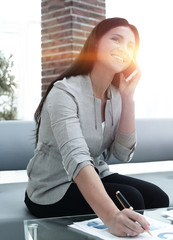Woman assistant at the workplace in the office