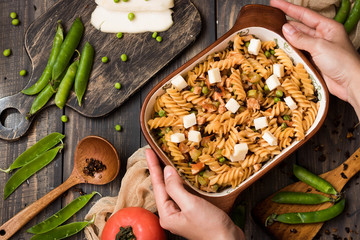 Fusilli pasta with zucchini, goat cheese and green peas