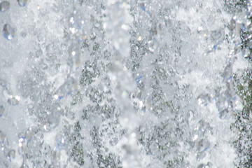 a torrent of white foam and spray; fountain close-up