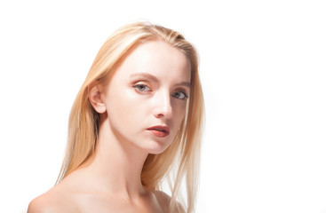 Fototapeta premium Portrait of a beautiful blonde on a white background.
