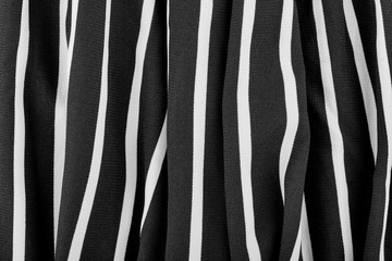 Black and white stripes. Striped black and white textile pattern as a background. Close up on vertical stripes material texture fabric.