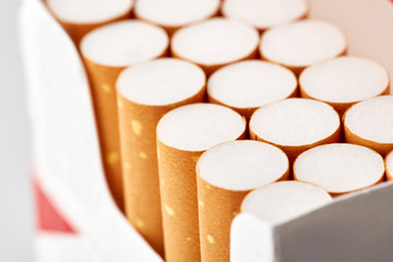 cigarettes in a pack close-up on a white background. Drug addiction. Smoking of tobacco. cancer. Nicotine. Bad habit.